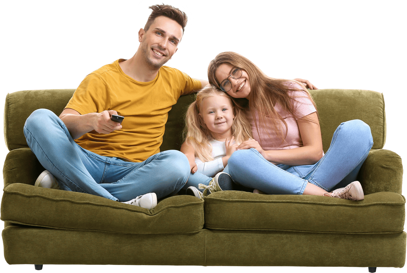 Family watching TV on a sofa